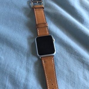 Apple Watch series 1 with leather band and charger